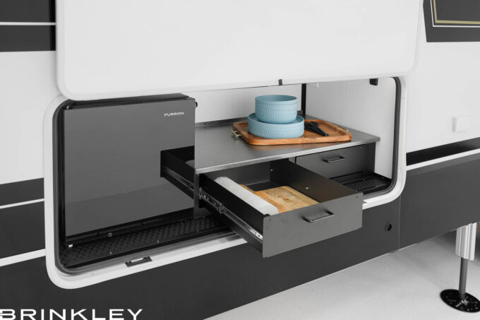 Fifth Wheel Exterior/Outside Kitchen with a Fridge on the Campside of the RV