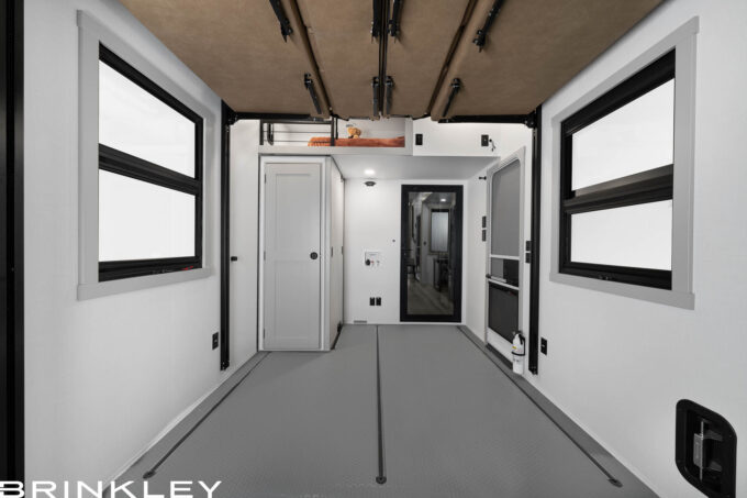 | Model Gx Fifth Wheel Toy Hauler Line 110 Fifth Wheel, second bathroom that's a convertible MAX-Space half bath with fold-away walls in a Model Gx toy hauler garage