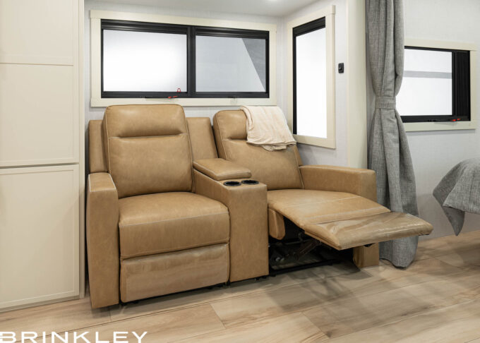 The Brinkley Model I 235 Luxury Travel Trailer features premium Thomas Payne Seismic Series theater seating. Unlike other manufacturers that often use standard stock vinyl, Brinkley upgrades to heavy-duty materials designed for longevity. This commitment to quality ensures your furniture withstands heavier use and stays comfortable for the long haul.