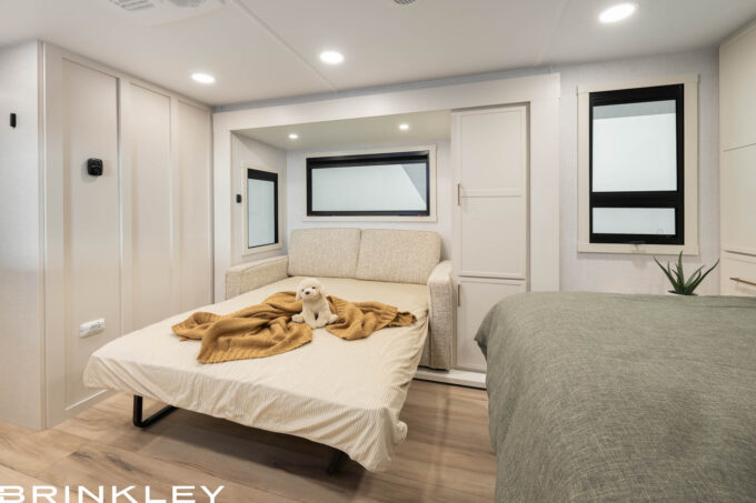 Optional 62 inch Tri-Fold Sofa converted into a bed in a Brinkley RV Model Ix 20x short small compact travel trailer