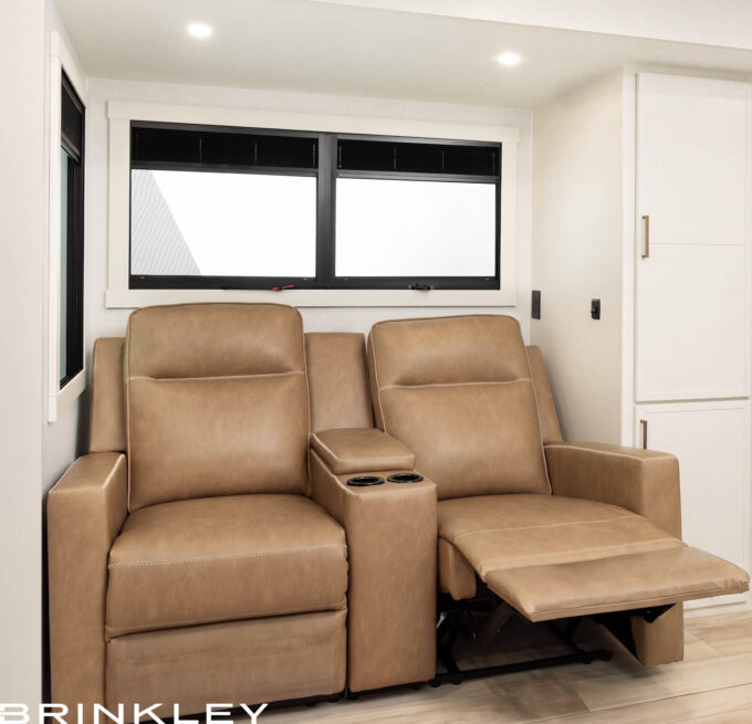 Luxury wall-hugger theater recliners in an RV living room area